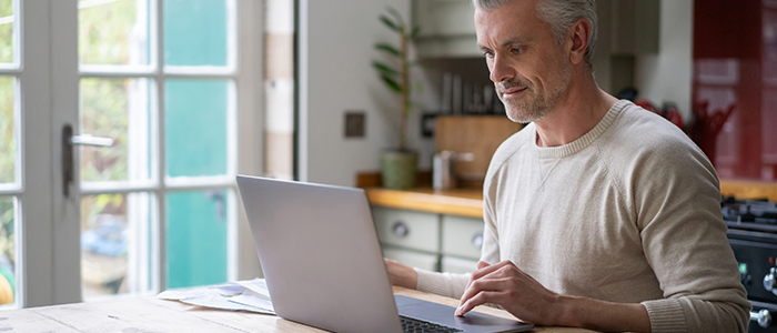 Man working at home on his laptop