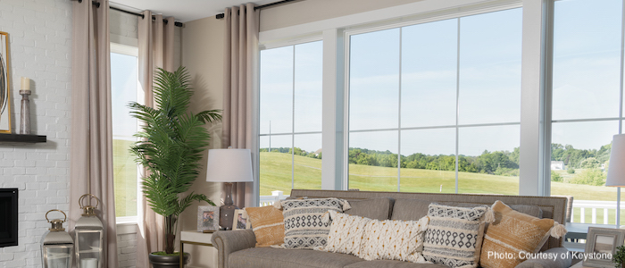 beautiful large windows letting natural light into living room